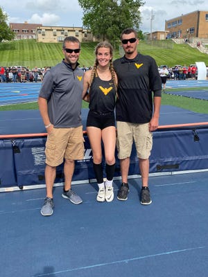 Colonel Crawford's Liv Krassow set a new school record of 5-6.25 in the high jump en route to a regional title. She stands with coaches Mike and Colten Moore.