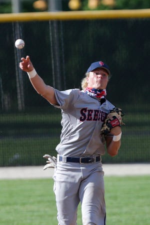 Seeger's Khal Stephen (21) throws to first during the first inning of an IHSAA sectional baseball game, Wednesday, May 26, 2021 in Delphi.