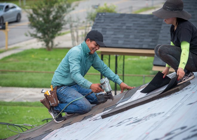 Workers repair the roof of a home damaged by Hurricane Delta, which slammed into Louisiana last year. Sarasota-based Gulfstream Property & Casualty Insurance wrote policies in Louisiana, which was hit by five named storms in 2020. Gulfstream is being liquidated.