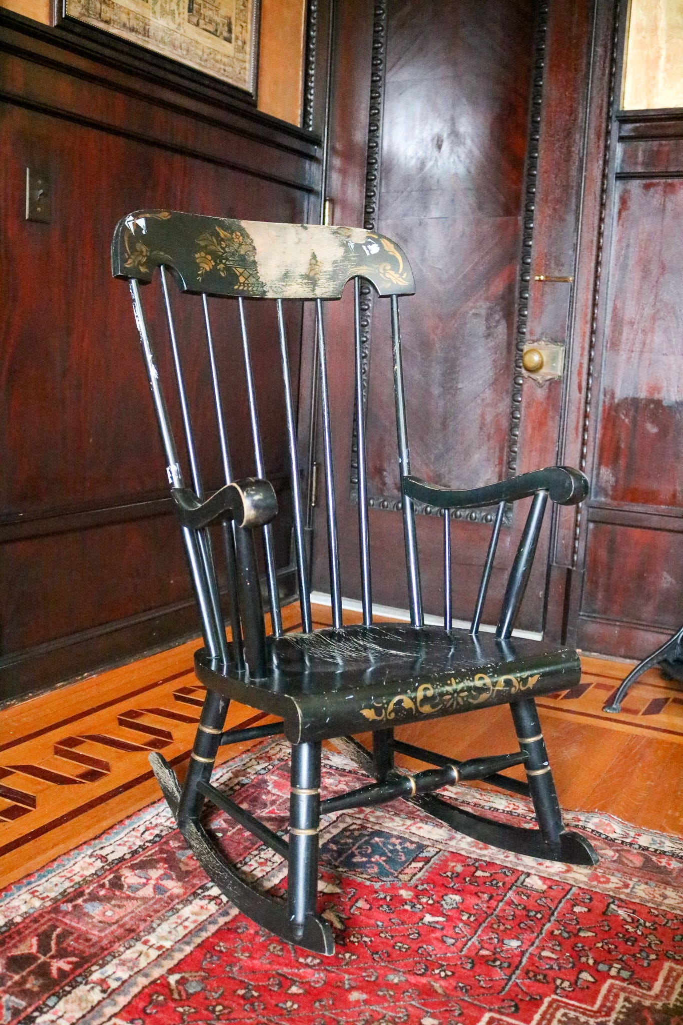 This rocking chair was left at Muhammad Ali's grave at Cave Hill Cemetery in Louisville, Kentucky. Empty chairs are often used as a symbol of death to recognize the space lost loved ones leave behind.