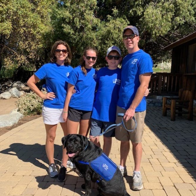 The Walz family — Mollie, Lucy, William and Dr. Christopher — have volunteered their time to raise a puppy for Guide Dogs of the Desert.