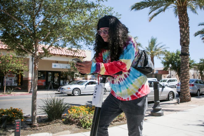 Coachella resident Joven Ruiz uses the Bird scooter app in downtown Coachella, Calif., on the launch day of the app-based transportation method on Thursday, May 27, 2021.