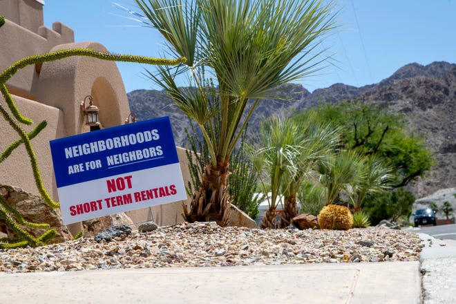 Some homes in the La Quinta cove have displayed yard signs saying "Neighborhoods Are For Neighbors, Not Short Term Rentals," in La Quinta, Calif., on May 27, 2021.      