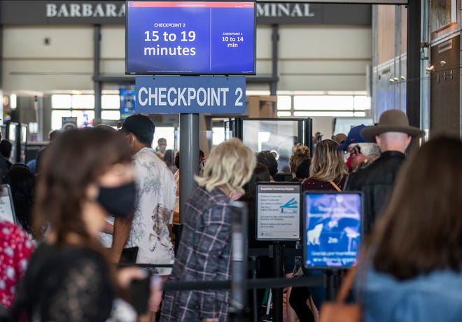 Travelers wait to check in at Austin-Bergstrom International Airport on May 28, at the start of the Memorial Day weekend. On Memorial Day, passenger traffic rose to 25,354 at the airport, the single busiest day since the coronavirus pandemic began.