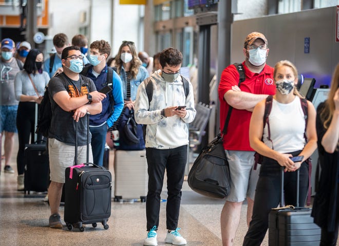 Travelers wait to check in at Austin-Bergstrom International Airport on May 28. in recent months, airlines have rolled out a number of nonstop flights into and out of the airport, which makes it even more attractive to out-of-state leisure travelers.