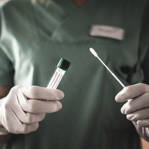 A nurse holds a swab for the coronavirus / COVID-1