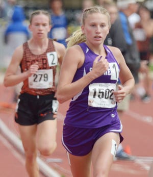 Southeast of Saline’s Jentrie Alderson passes Colby’s Lara Murdock during the 3,200-meter run at the Class 3A state track and field meet Friday at Cessna Stadium in Wichita. Alderson won with a time of 11:13.06.