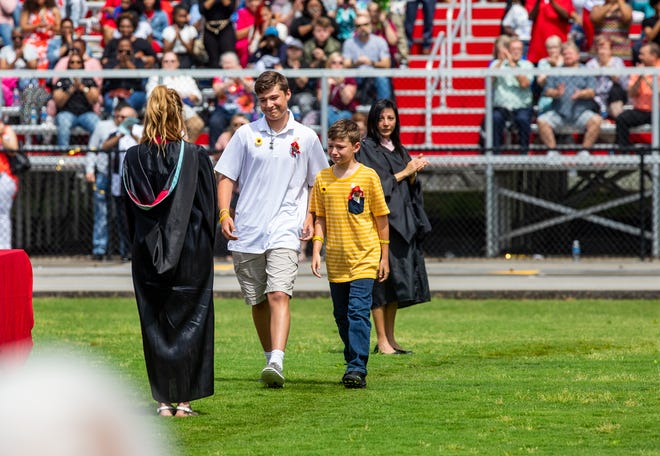 Madelynn Troutt's brothers walked in Butler's graduation to accept the diploma for their sister on what would have been her 18th birthday. May 28, 2021