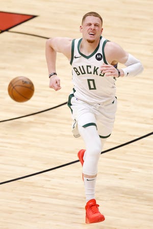 Donte DiVincenzo suffers an ankle injury in the second quarter Thursday night against the Heat.