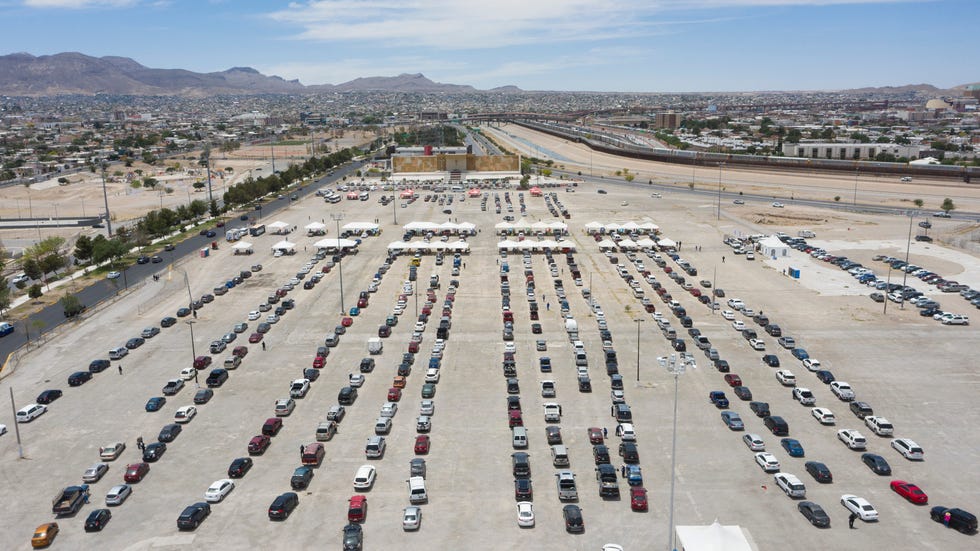 Vehicles line up at a COVID-19 vaccination site at El Punto en el Chamizal on May 24 as 50- to 59-year-olds receive the first dose in Juarez, Mexico.