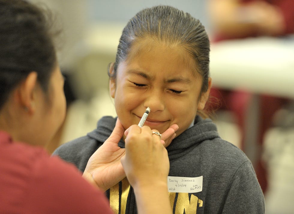 Daisy Jimenez gets FluMist influenza vaccine at Lincoln Elementary School in Anaheim, Calif., on Oct. 23, 2015.
