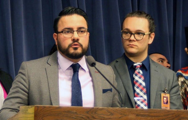 Illinois state Sen. Omar Aquino, left, speaks at the state Capitol in this file image.