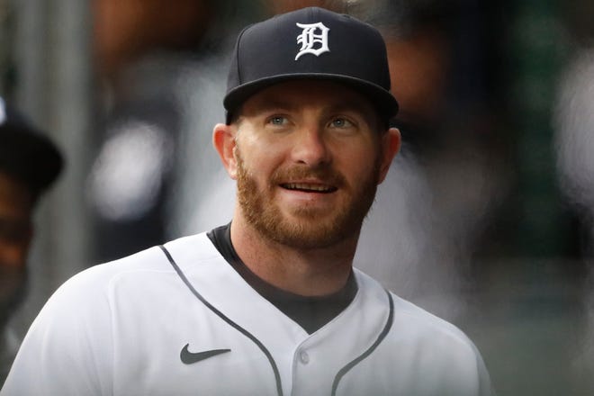 Detroit Tigers left fielder Robbie Grossman (8) smiles from the dugout before the game against the New York Yankees at Comerica Park on May 28, 2021.