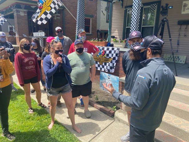 Indy 500 three-time champion Helio Castroneves meets with season ticket holders Jameson and Kimmy Terzini along with their friends and neighbors.
