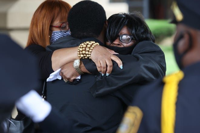 Widow Cathy Beck is consoled by family and friends during her husband Ivory Beck Sr.'s funeral services at New Life of Memphis church on Saturday, May 29, 2021.