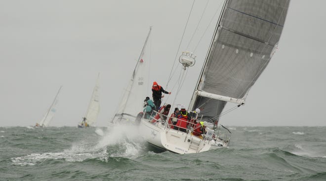 The crew of Wings gets tossed in the waves during last year's Figawi, when weather postponed Saturday's race. More photos at www.capecodtimes.com/news/photo-galleries.