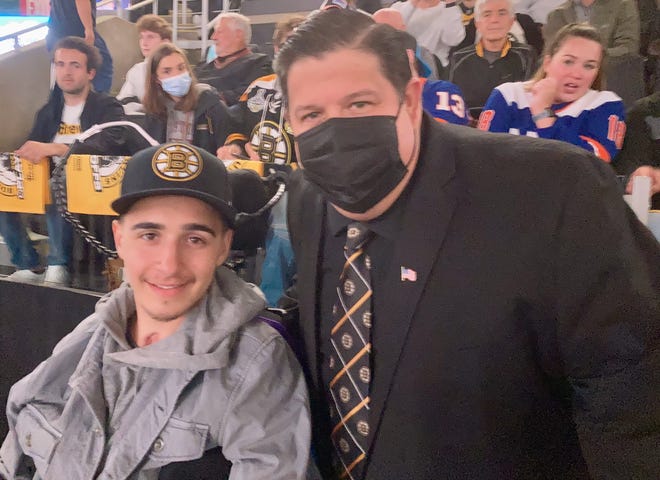 AJ Quetta and Bruins national anthem singer Todd Angilly meet up at a Bruins game last season.