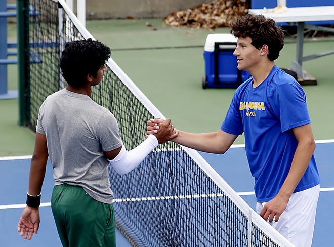 Mason's Vignesh Gogineni and Gahanna Lincoln's Brandon Carpico meet at the net after Carpico defeated Gogineni for the Division I state singles title in 2021 at Lindner Family Tennis Center in Mason.
