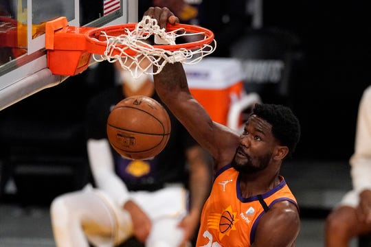 Phoenix Suns center Deandre Ayton dunks during the first half in Game 4 of an NBA basketball first-round playoff series against the Los Angeles Lakers Sunday, May 30, 2021, in Los Angeles. (AP Photo/Mark J. Terrill)