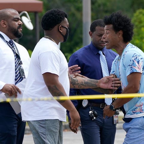 Clayton Dillard, right, talks with a police offici