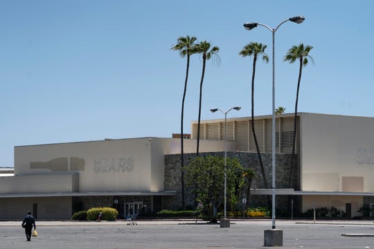 This Thursday, May 27, 2021, photo shows the closed Sears in Buena Park Mall in Buena Park, Calif. California state lawmakers are grappling with a particularly 21st-century problem: What to do with the growing number of shopping malls and big-box retail stores left empty by consumers shifting their purchases to the web. A possible answer in crowded California cities is to build housing on these sites, which already have ample parking and are close to existing neighborhoods.