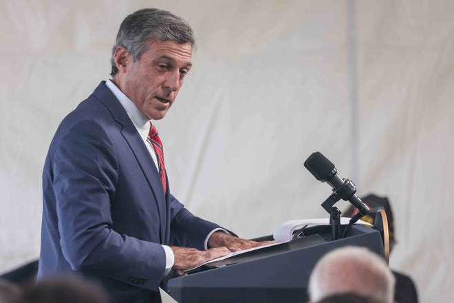Gov. John Carney gives remarks during the Memorial Day Ceremony Sunday, May 30, 2021, at Veterans Memorial Park in New Castle.