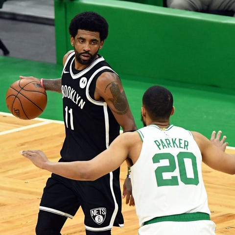 Brooklyn Nets guard Kyrie Irving (11) dribbles the