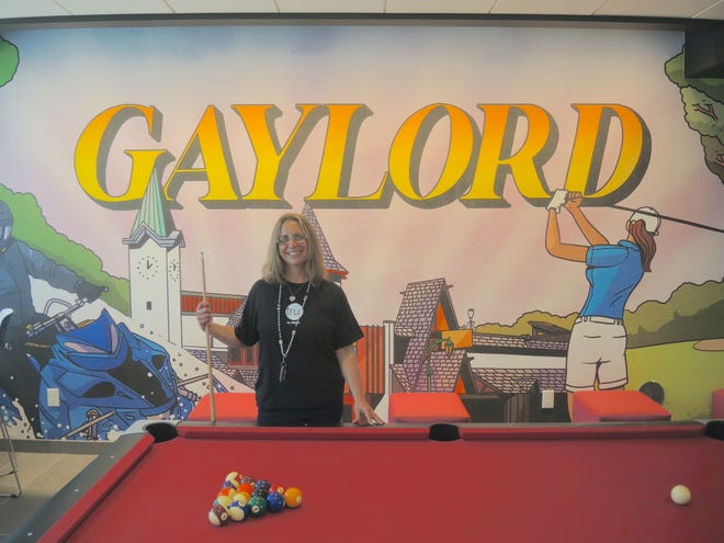 Angie Barz is the general manager of the Tru by Hilton hotel on West Main Street in Gaylord which opened at the end of March. She is at the pool table in the hotel's lobby.