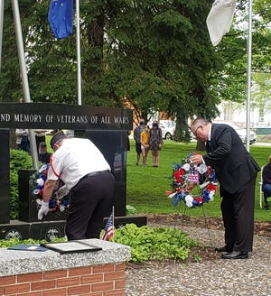 At last year's Memorial Day ceremony, American Legion Post 31 Commander Ted Canellos, left, and Kewanee Mayor Gary Moore laid wreaths in honor of fallen soldiers.