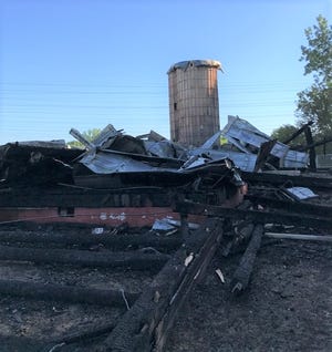 Flames destroyed the Cady-Boyer Barn  at Canton Township's Preservation Park on Sunday, May 30, 2021.