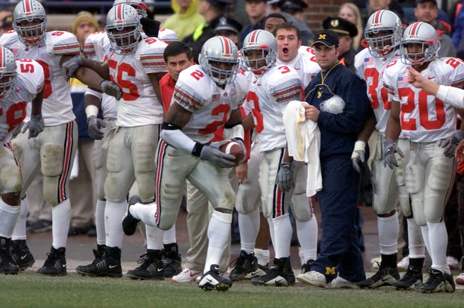 Michael Doss races along the OSU sideline after a 2nd half interception and returned it 36 yards, 3 points soon followed. (Mike Munden/Dispatch)