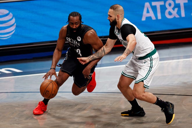 Brooklyn Nets guard James Harden drives to the basket past Boston Celtics guard Evan Fournier in the second half of Game 5 during an NBA basketball first-round playoff series, Tuesday, June 1, 2021, in New York. (AP Photo/Adam Hunger)