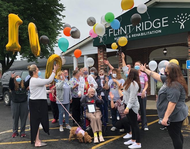 Family, friends and staff members at Flint Ridge Healthcare released balloons last week marking the 100th birthday of Louise Wilkin (front, center).