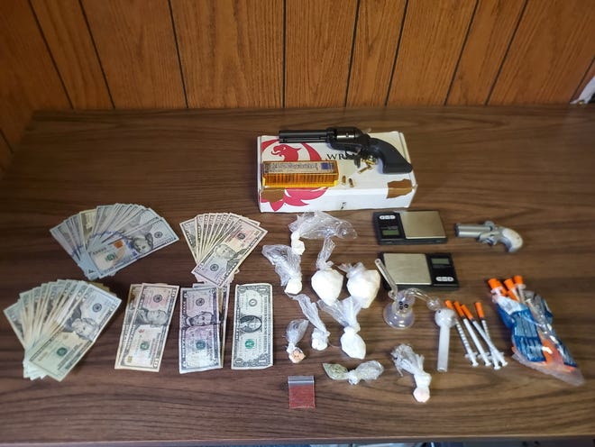 The Wayne County Drug Task Force confiscated more than 127 grams of cocaine, methamphetamine and fentanyl; more than $4,500 cash; two loaded handguns; pills; and other drug paraphernalia when executing a search warrant Wednesday, June 2, 2021, in the first block of South 21st Street.