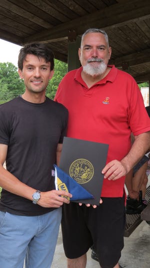 N.C. Rep. Jon Hardister presented Joel Leonard, of Asheboro, with a North Carolina state flag that had been flown over the state capitol building in his honor.