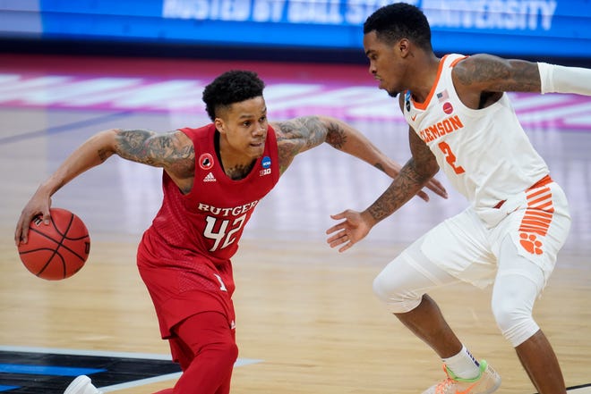 Rutgers guard Jacob Young, left, drives on Clemson guard Al-Amir Dawes during the second half of their March 19 first-round game in the NCAA Tournament at Bankers Life Fieldhouse in Indianapolis.