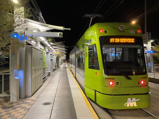 A Tempe streetcar vehicle is tested overnight on the Valley Metro light rail tracks near the 50th and Washington streets station in Phoenix.