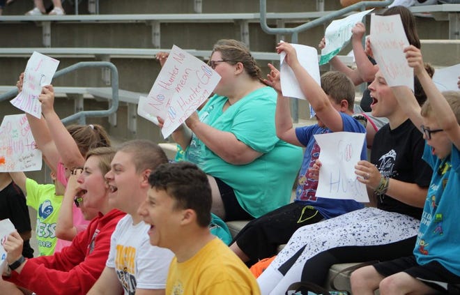 Those from the Arc of Sedgwick County cheer at a game for their favorite player, Hunter LaMunyon in 2019