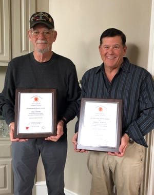 Retired Master Sgt. Paul Foster, left, and retired Col. Conrad Reynolds received appreciation awards from the Arkansas Military Veterans Hall of Fame for their years of service and dedication.