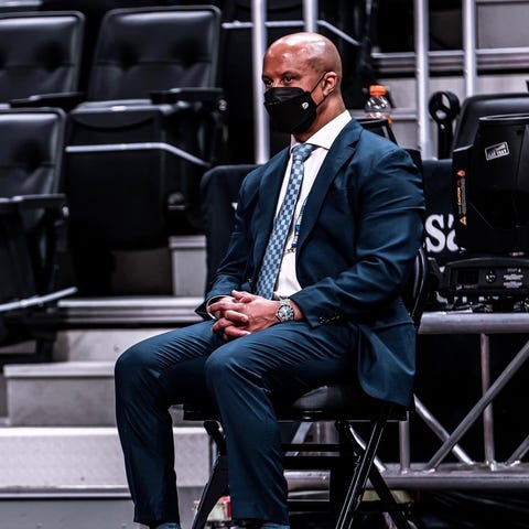 Rob Murphy sits courtside during a 2021 NBA game b