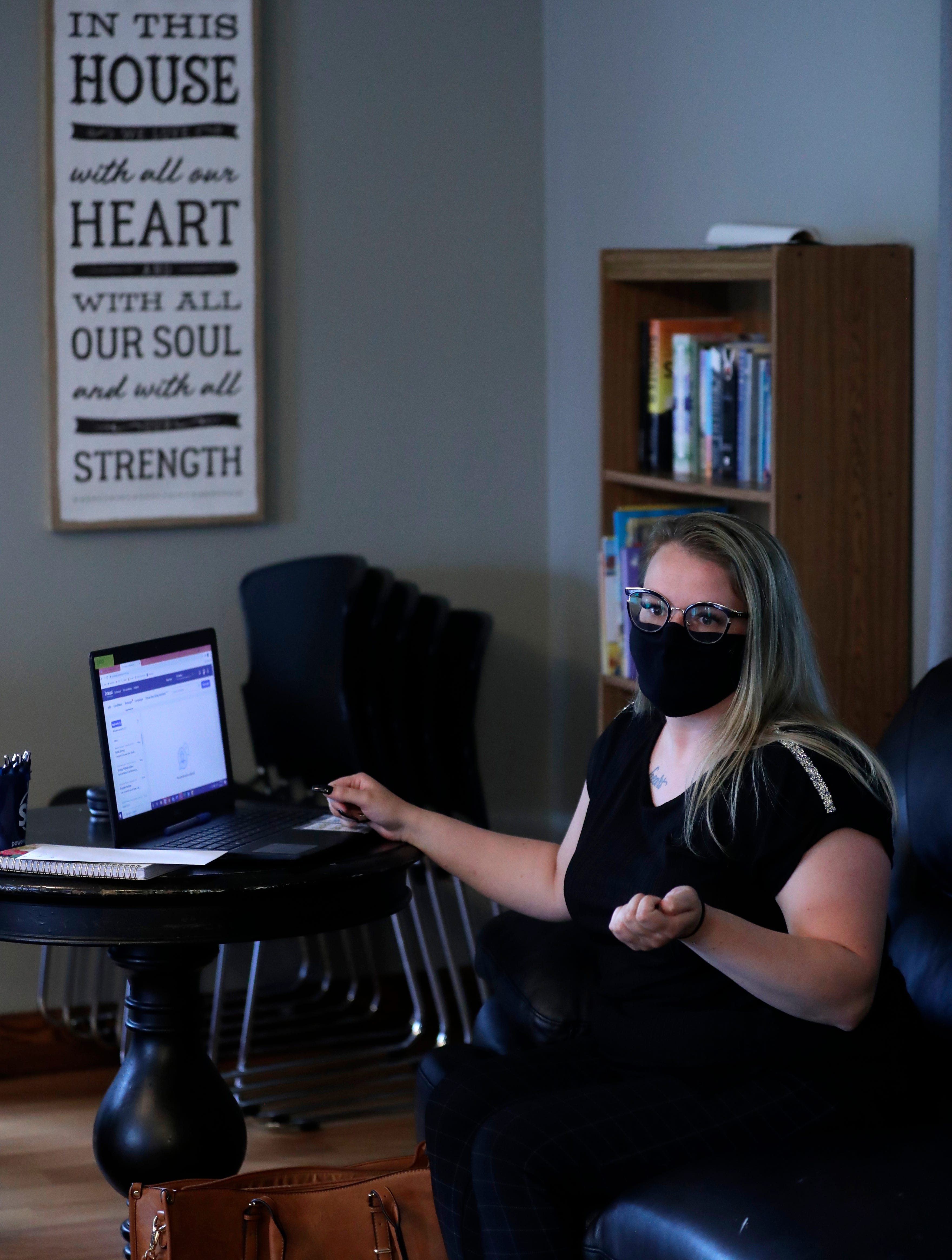 Jenna Dahlke talks with House of Hope residents about job opportunities and interview strategies during a meeting on June 3, 2021, in Green Bay.