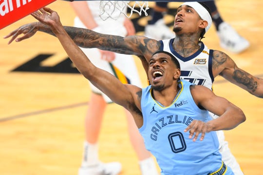 Memphis Grizzlies guard De'Anthony Melton (0) goes up against the Utah Jazz during the second half of Game 3 of an NBA basketball first-round playoff series Saturday, May 29, 2021, in Memphis, Tenn. (AP Photo/John Amis)