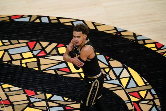 Atlanta Hawks guard Trae Young (11) reacts after the Atlanta Hawks score during the second half in Game 4 of an NBA basketball first-round playoff series Sunday, May 30, 2021, in Atlanta. (AP Photo/Brynn Anderson).