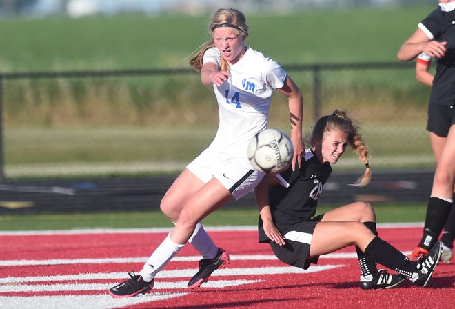 Van Meter's Mary Kelly passes the ball around Gilbert's Nora Kalvik during the second half in the Class 1A girls regional championship at Gilbert High School Friday, June 4, 2021, in Gilbert, Iowa.