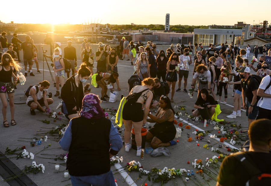 People gather for a vigil at the site where Winston Boogie Smith was killed on June 4, 2021 in Minneapolis, Minnesota. Smith was shot and killed yesterday during an altercation with law enforcement involving multiple agencies. Smith's family is demanding clarity in the case as authorities claim there is no video available from the incident.