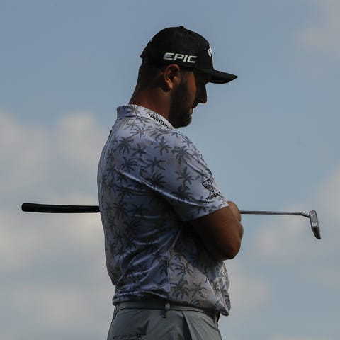 Jon Rahm waits to putt on 15 during the third roun