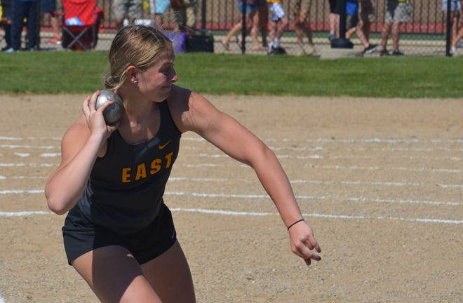 Zeeland East's Paige Westra competes in the Division 1 state track and field championships in the shot put.