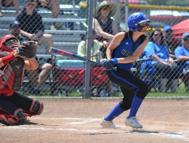 Harper Creek's Jordanne Norris takes a swing in this Division 2 district final softball contest at Harper Creek High School on Saturday.