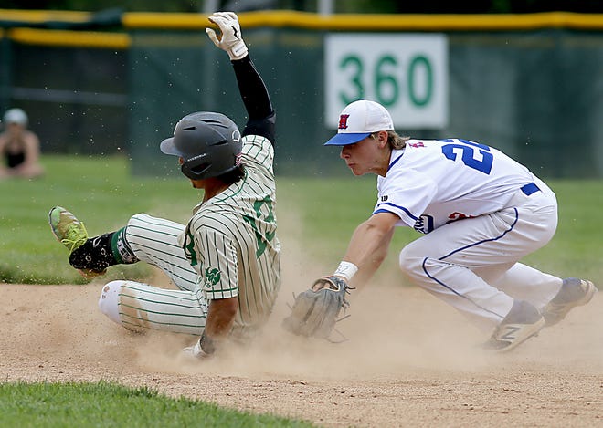 Badin High School runner Sergio DeCello is safe at second with a double as Highland second baseman Rider Minnick can't make the tag during a Division II regional baseball final at Mason June 6, 2021. Badin won 12-3.