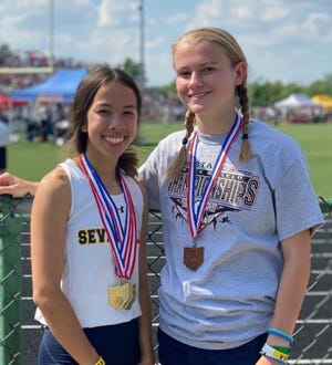 Seven Hills track stars Mackenzie Hartman, left, and Abby Heck propelled the Stingers to third place as a team in the OHSAA Division III state track and field championships.